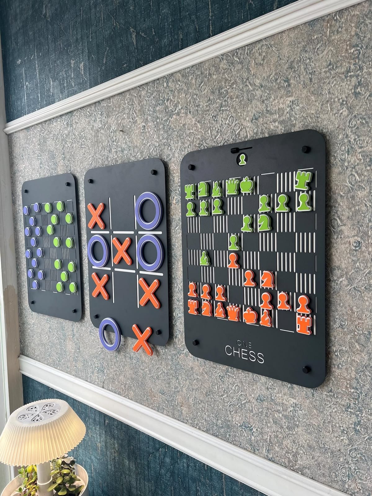 Wall-mounted interactive checkers, tic-tac-toe, and chess games