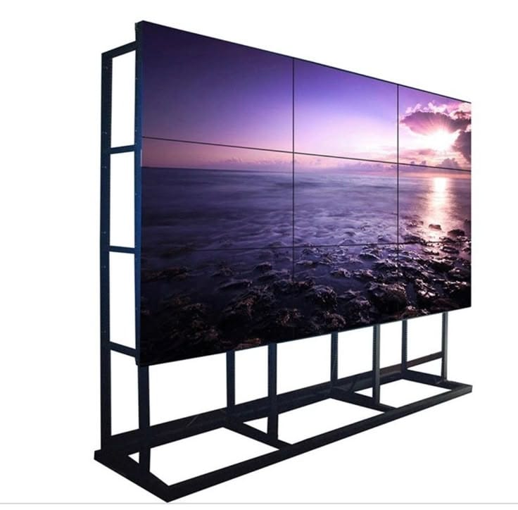 3x3 LED video wall display on a floor stand showing a scenic sunset