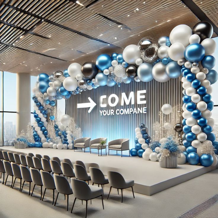Blue, white, and silver balloon installation as a corporate stage backdrop