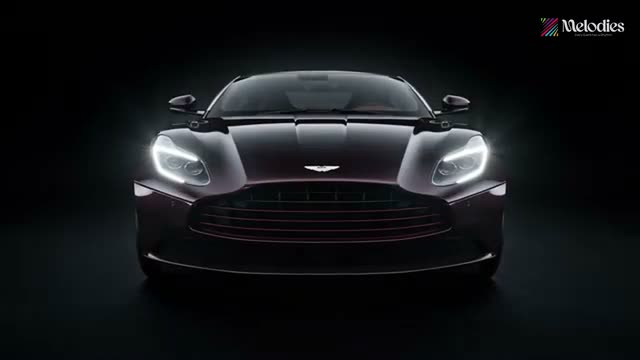 Sports car headlights glowing in a dark studio